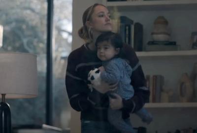 A nanny holds a baby