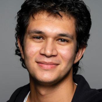 J. Mendoza smiling